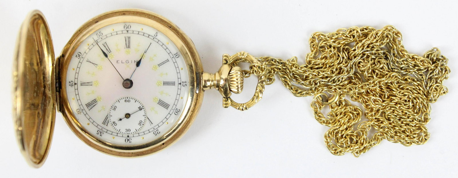 14k yellow gold ladies hunter case pocket watch: 14k yellow gold ladies closed face pocket watch and chain. Elgin, roman numerical hours, Arabic numerical minutes, second hand, fine gilt enamel face, ornate floral case marked 14k, monogramed interio