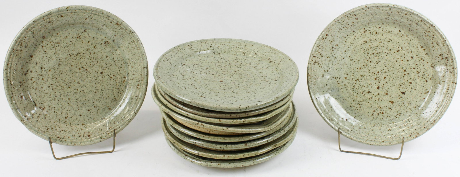 10 Libow Studio Art Pottery Dinner Plates: set of 10 signed "Libow" (?) studio art pottery dinner plates with incised rim decoration, brown speckled glaze in the manner of Nancy Wickham Boyd 12" dia. Some firing irregularities