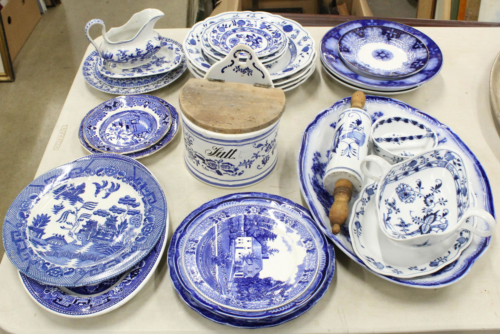 Collection of Blue and White Porcelain: Collection of assorted blue and white Porcelain tableware including Meissen Blue Onion decorated pieces with crossed sword marks, several flow blue plates and platters, blue willow transfer decorated