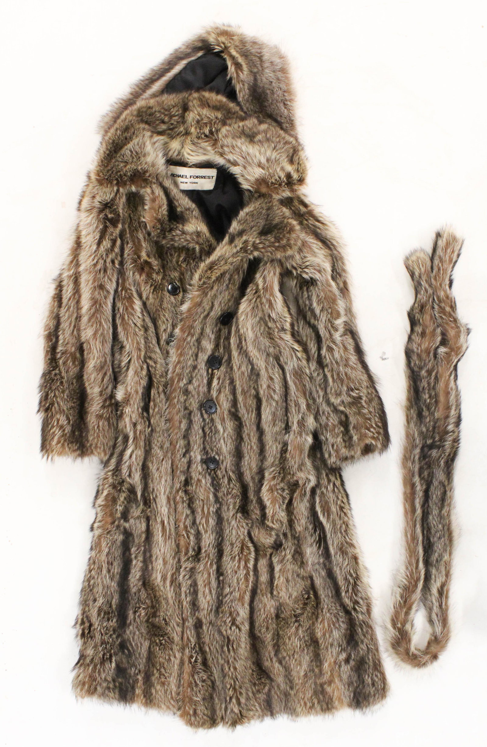 Full length Raccoon fur coat: A Michael Forrest New York full length raccoon fur coat with belt. Size 6. Good condition