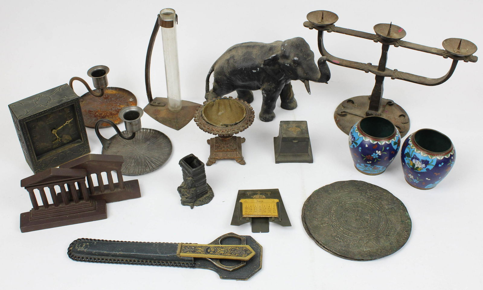 Lot of Decorative Metalware Accessories: Lot of decorative metalware accessories including Bradley and Hubbard Pantheon bookends, pair of cloisonne vases, Arts and Crafts handwrought candelabra, Roycroft type hammered copper vase, pot metal