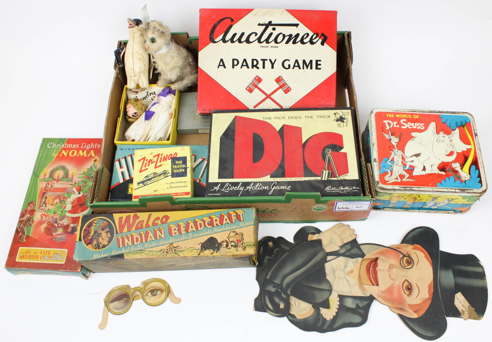 Lot of Vintage Games, Christmas Lights: Lot of vintage games and items including Auctioneer board game, Charlie McCarthy cut out ventriloquist doll, Noma Christmas lights in original box, etc.