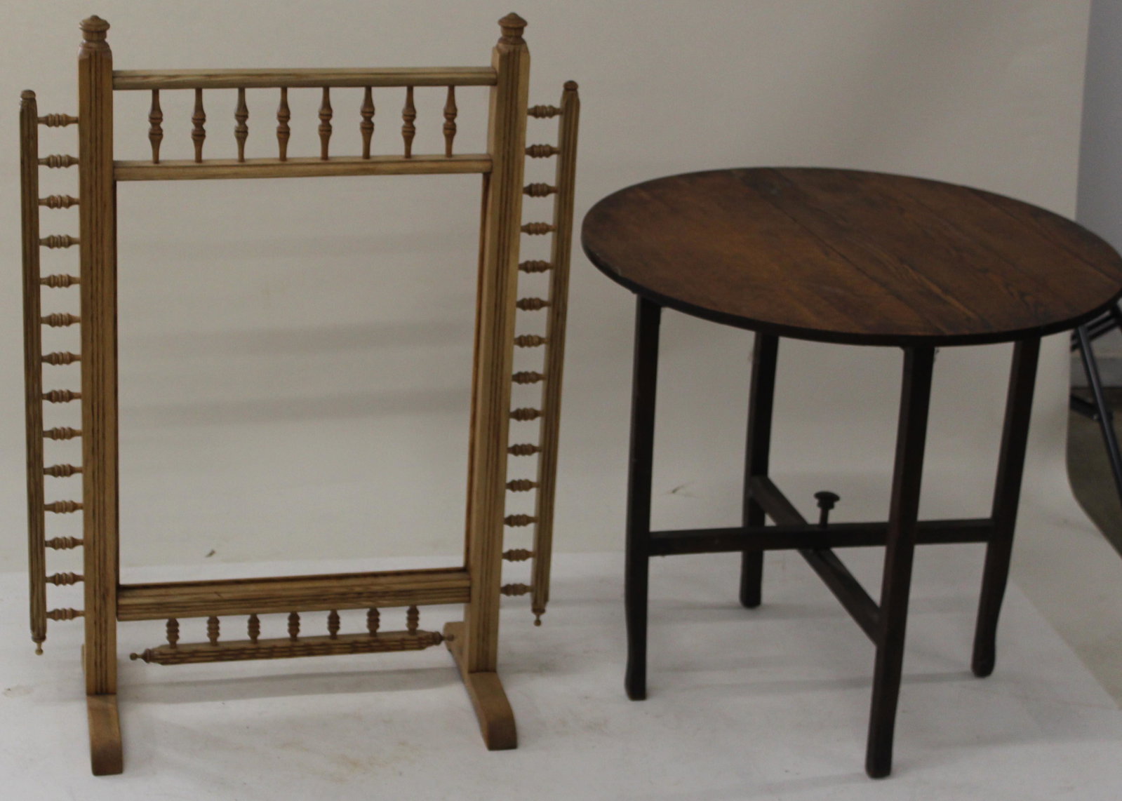 Oak firescreen surround and oak table: Aesthetci Movement oak firescreen surround with turned spandrels and oak folding drop leaf tuckaway table.