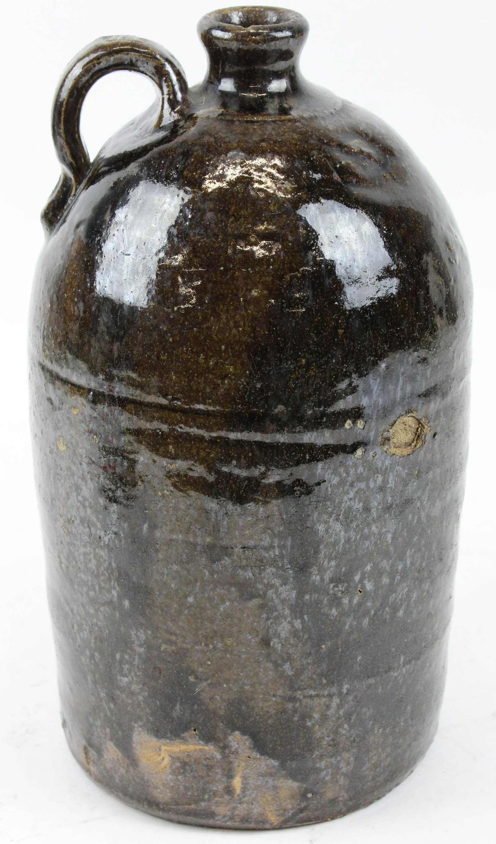 John H Long, Crawford Co., Georgia Stoneware: Ca 1890- 1900 John H Long, Crawford County, Georgia stoneware jug, alkaline glaze, signed on handle JHL, stone burst on side, ht 12"