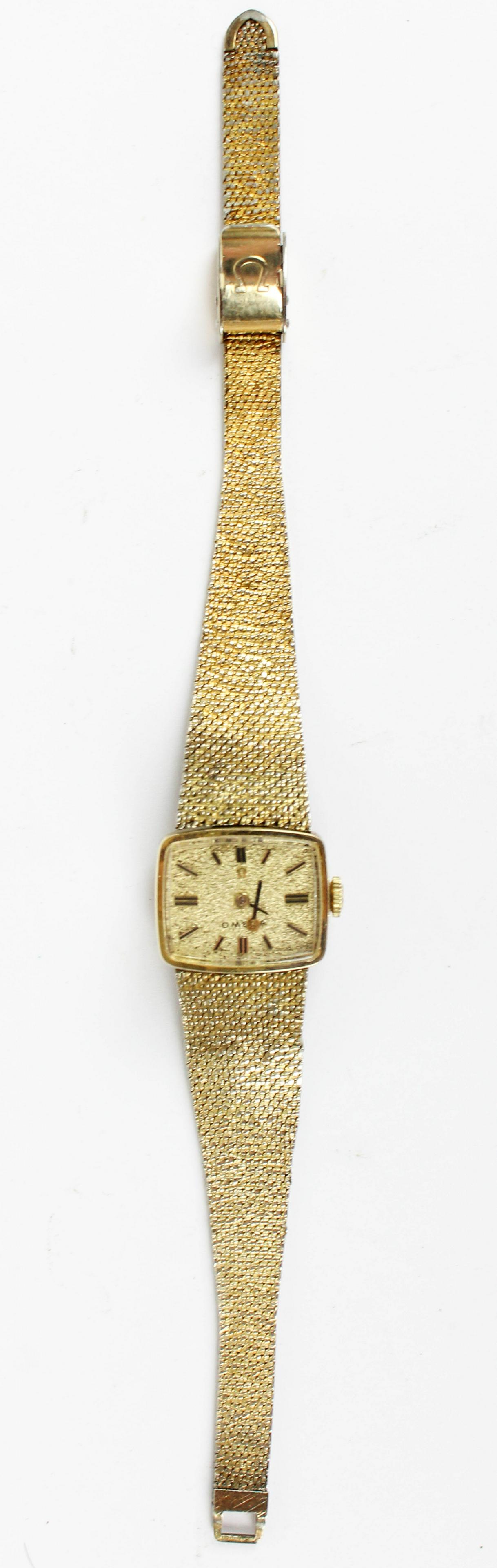 Omega Ladies Gold Filled Wristwatch: 1960's Omega 14k. gold filled ladies wristwatch with woven style band, textured face -one hand loose, wear to band 7.25" overall length, untested