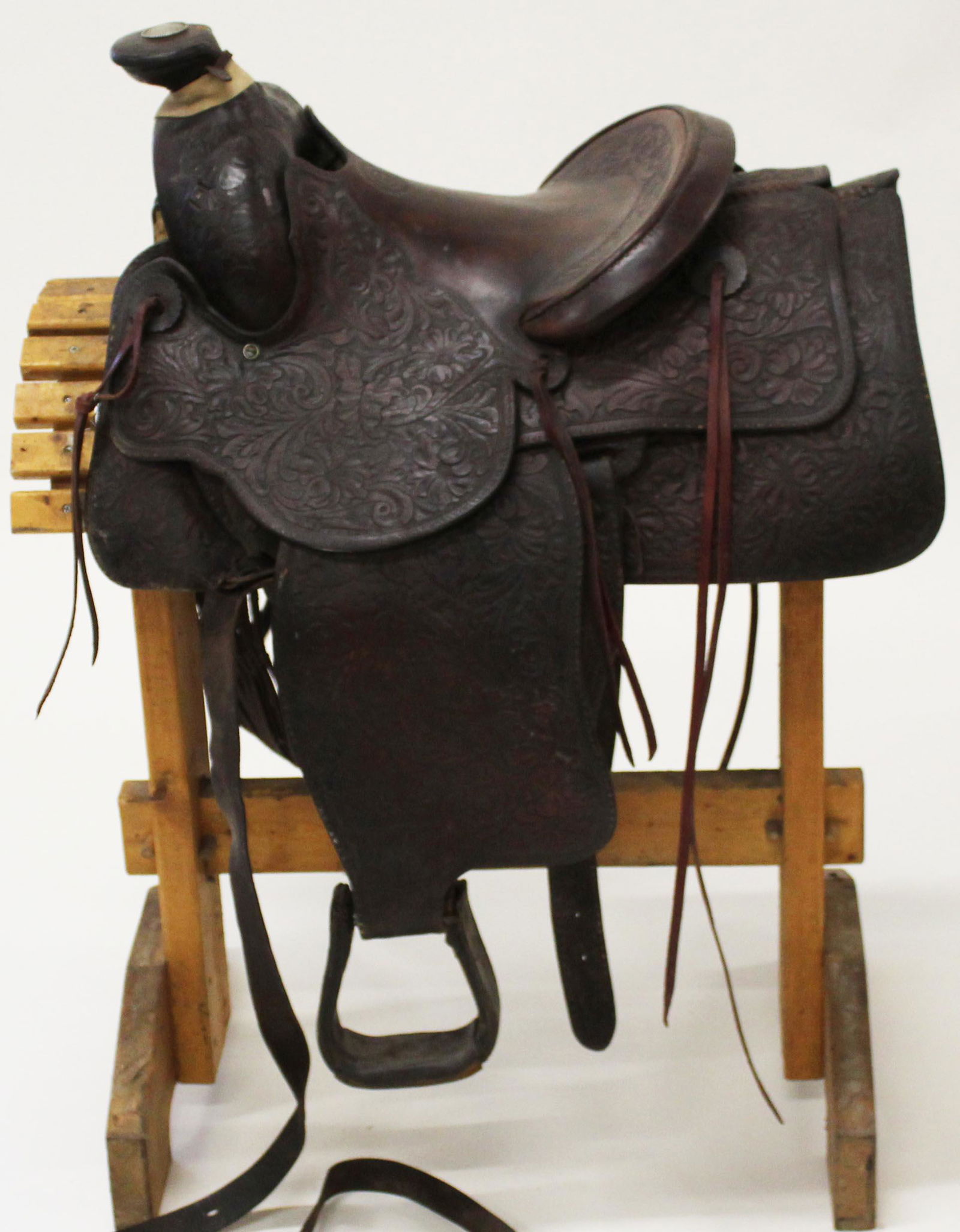 20th c Green's, Richmond, CA Western saddle: 20th c Western Saddle with silver concho in horn , Stamped "Green's Richmond Calif.." 26" long, sold with 20th c pine saddle rack and vintage US Forestry Service Canteen.