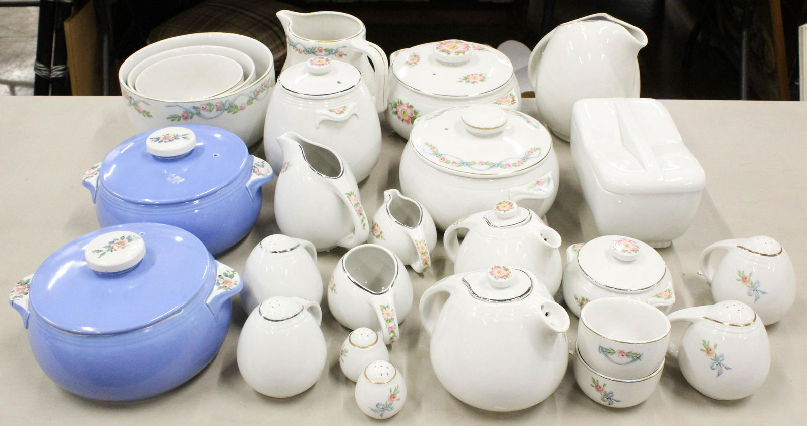 23 pcs. Hall Rose Parade Pottery Ovenware: Collection of 23 pcs. Vintage 1940's Hall "Rose Parade" pattern pottery oven proof bakeware and kitchenware including nest of mixing bowls, covered casseroles, pitchers, tea pots, range shakers, cream