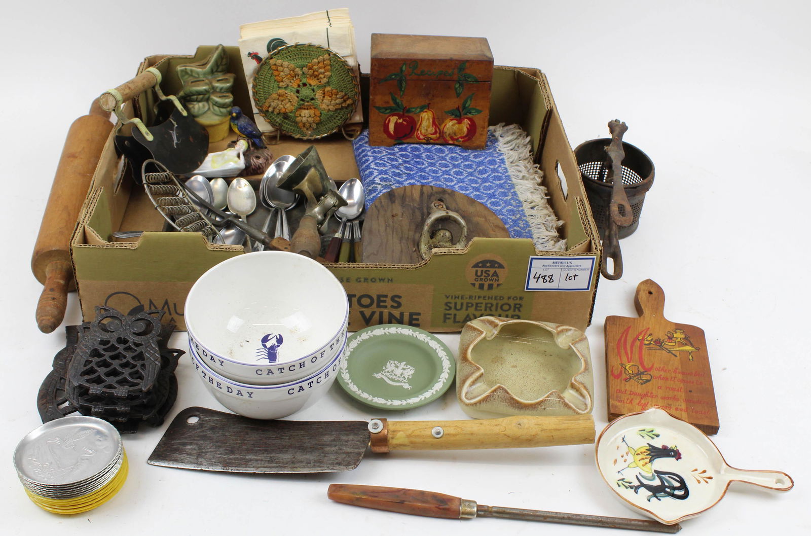 Lot of Vintage Estate Kitchenware: Lot of Vintage Estate Kitchenware including early Gilchrist cone shaped ice cream scoop, ceramic spoon holders, recipe box, Bakelite handed utensils, choppers, cast iron trivets, hand-woven placemats,