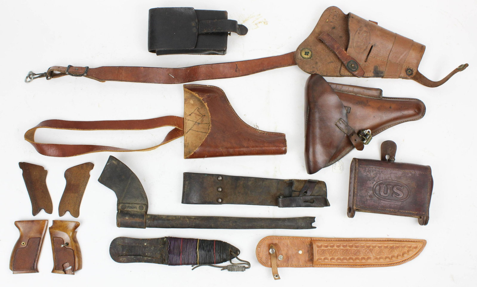 Lot of Military Leather: Circa 1898 Cartridge box, P38 holster, Knife sheath with wire decoration, US Branded Holster, Shoulder holster, WWII Era cartridge box.