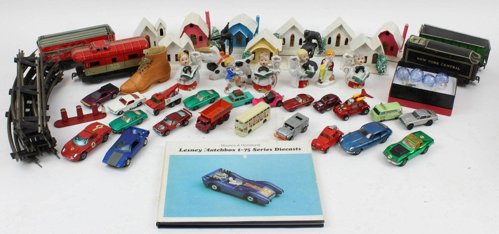 Group of Vintage Toys and Christmas Items: Group of Vintage Toys and Holiday Items, including 1950's mica glittered Christmas village houses, tin litho Marx train cars and track, cast metal clown figures, German porcelain shoe form toothpick h