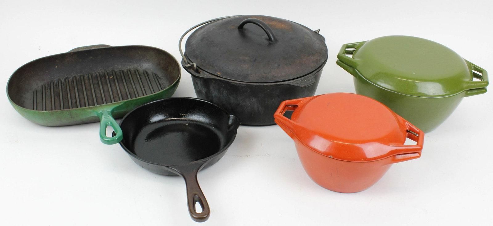 Enamel, Cast Iron Cookware incl Le Creuset: Enamel, cast iron cookware including LeCreuset skillet ,2 Copco- Denmark covered dishes, cast iron Dutch oven, small frying pan (5 pcs), lengths/ diameters 7 1/2" to 14"