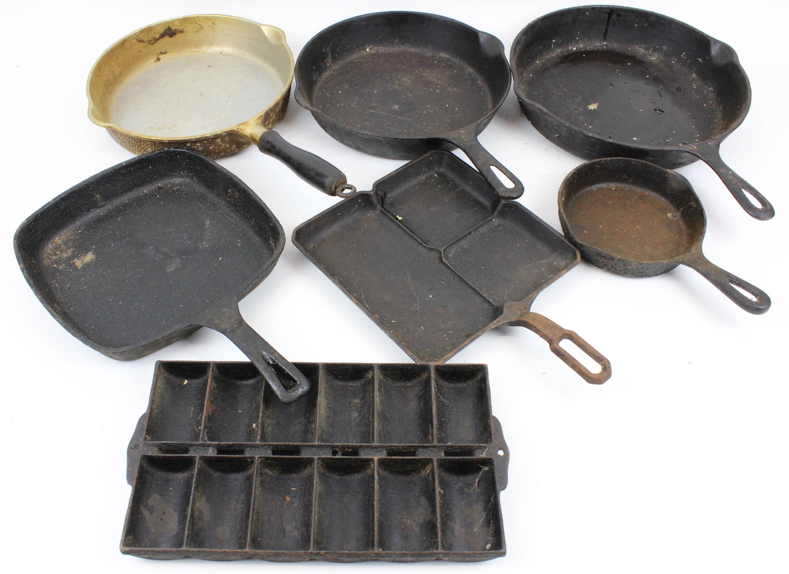 Cast Iron Cookware including Griswold: Cast iron cookware (7 pcs), including large block letters Griswold Colonial Breakfast skillet, Griswold aluminum skillet, etc, diameters from 6" to 12"