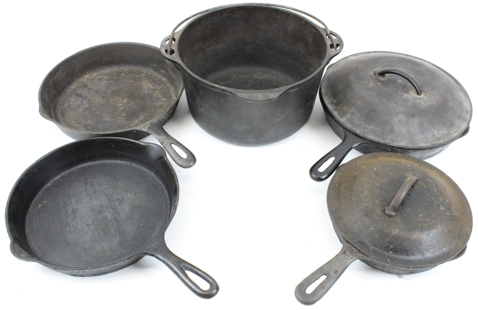 Cast Iron Cookware including Griswold: Cast iron cookware (7 pcs), including large block letters Griswold #8 Dutch Oven base (lid in lot is not a perfect fit), 3 skillet including Miami, diameters from 8" to 11"