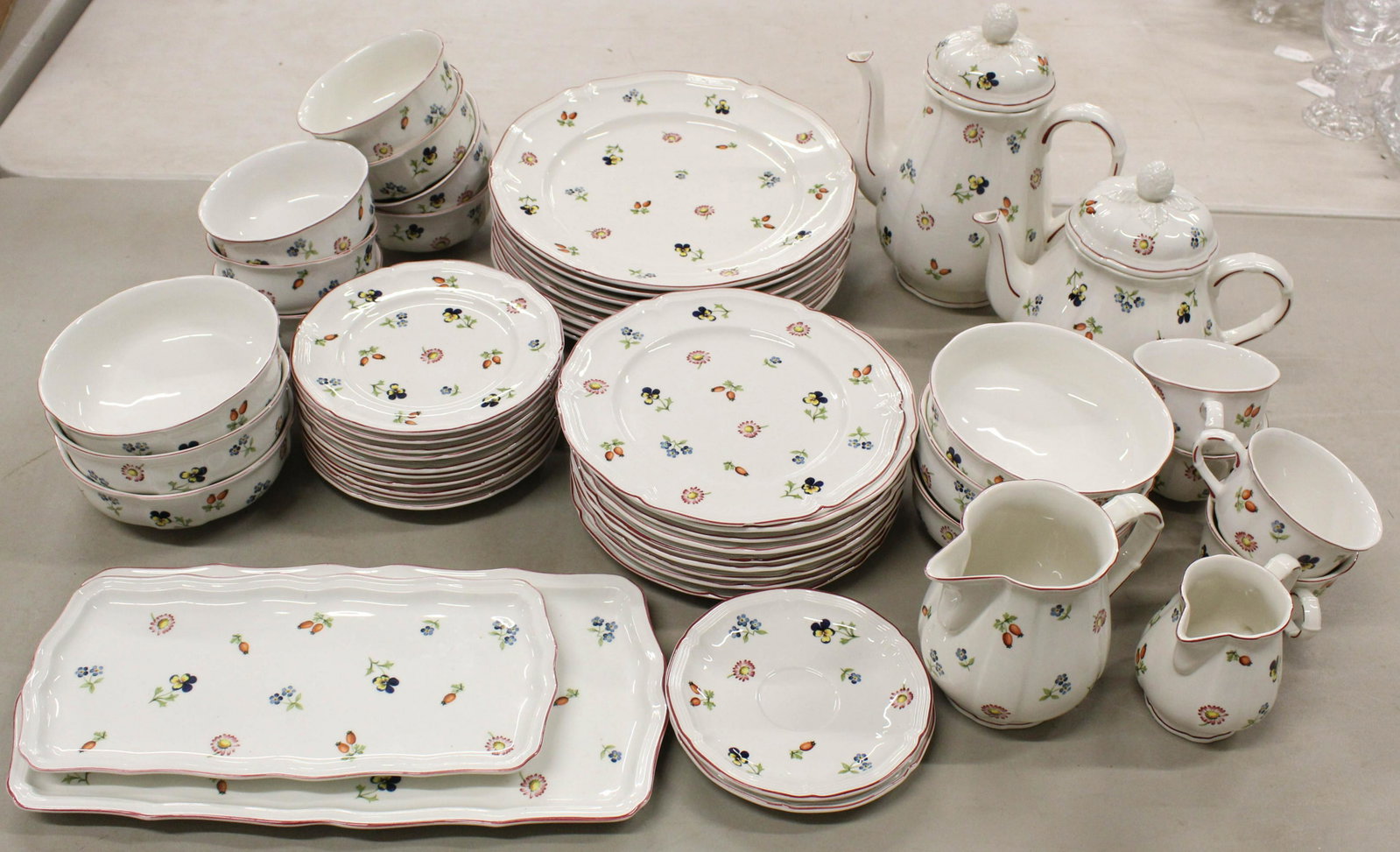 52 pcs. Villeroy and Boch Petite Fleur Dinnerware: 52 pcs. Villeroy and Boch "Petite Fleur" pattern fine German porcelain dinnerware including dinner plates, coffee pot, tea pot, cake trays, bowls, etc.