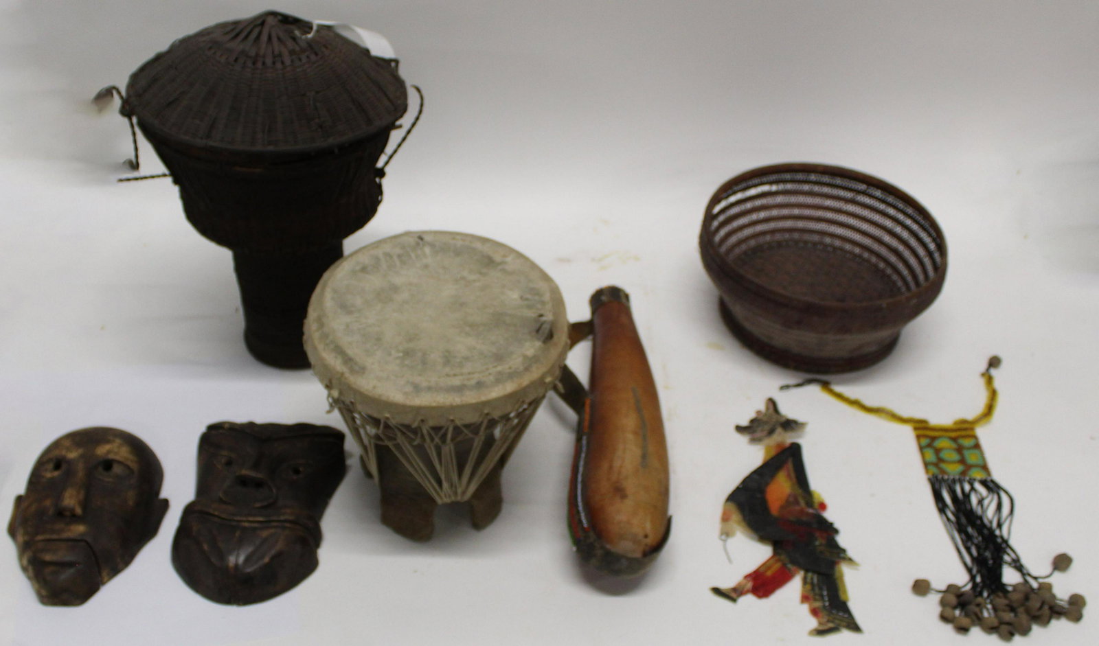 Mixed Ethnographic lot including Drum and Baskets: Mixed ethnographic lot including Chinese woven basket , Kuba People - Democratic Republic of Congo "Pedestal Basket", West African calabash canteen with bead decoration 17" long; Two Asian Masks, Bali