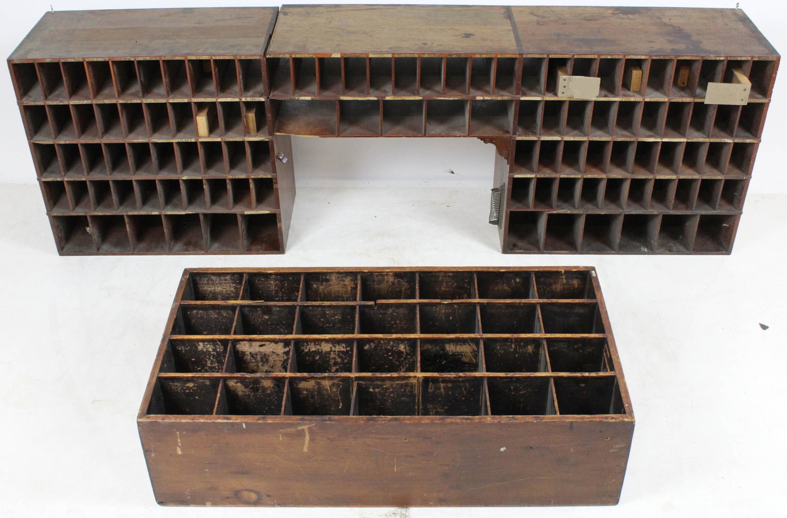 Ca. 1900 Vermont Post Office Boxes: A ca. 1900 pigeon hole group of letter boxes. Most boxes with town name above each hole. One section for table top, extra side section. Desk top section 68" long, 12" deep, 21" high. Extra section 17"