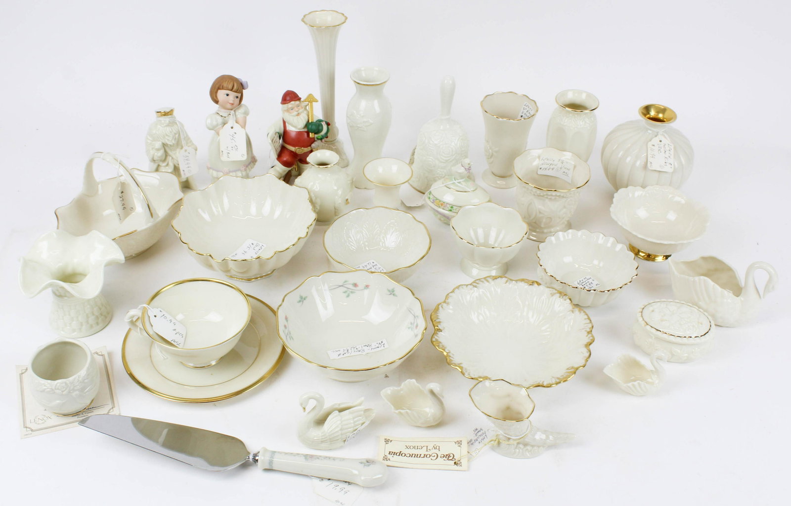 32 pcs. Lenox Bone China Porcelain: Collection of 32 pcs. Lenox bone china ivory toned porcelain small novelty and tableware items including swans, bud vases, Christmas figurines, bowls, bells, dresser boxes ht. 2.5"-7.5"