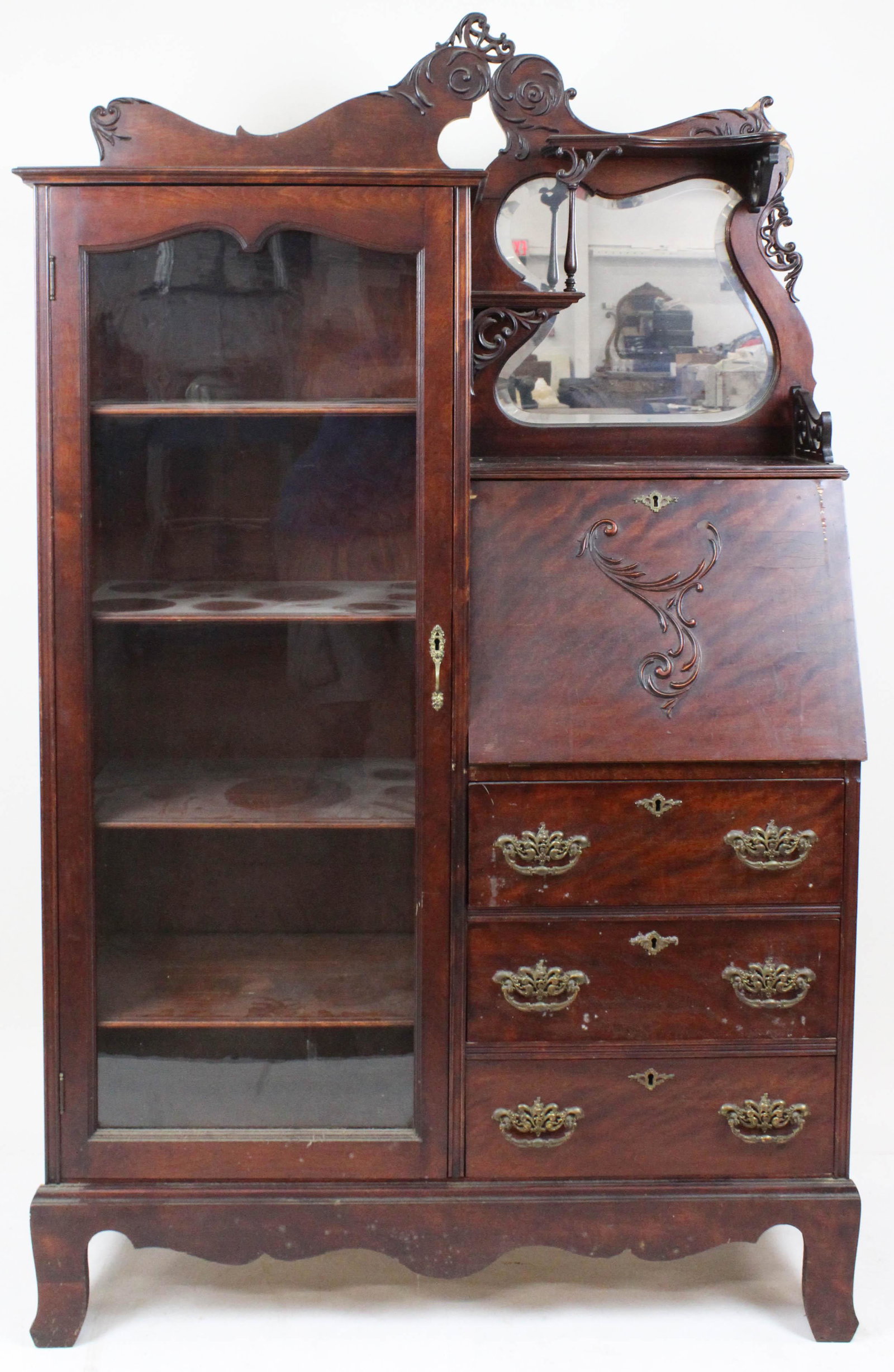 Victorian Ornate Side by Side: Ornate Victorian side by side. Stained flame birch. Original gilt brasses, beveled mirror, gallery, slant side lid, over 3 drawers, flat glass panel door. 40" wide, 67" high, 13" deep.