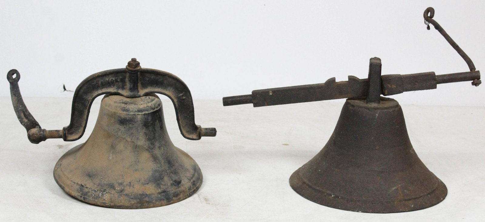 2 Cast Iron Bells: 2 cast iron bells, one missing clapper, diameters 13" to 14", no harps