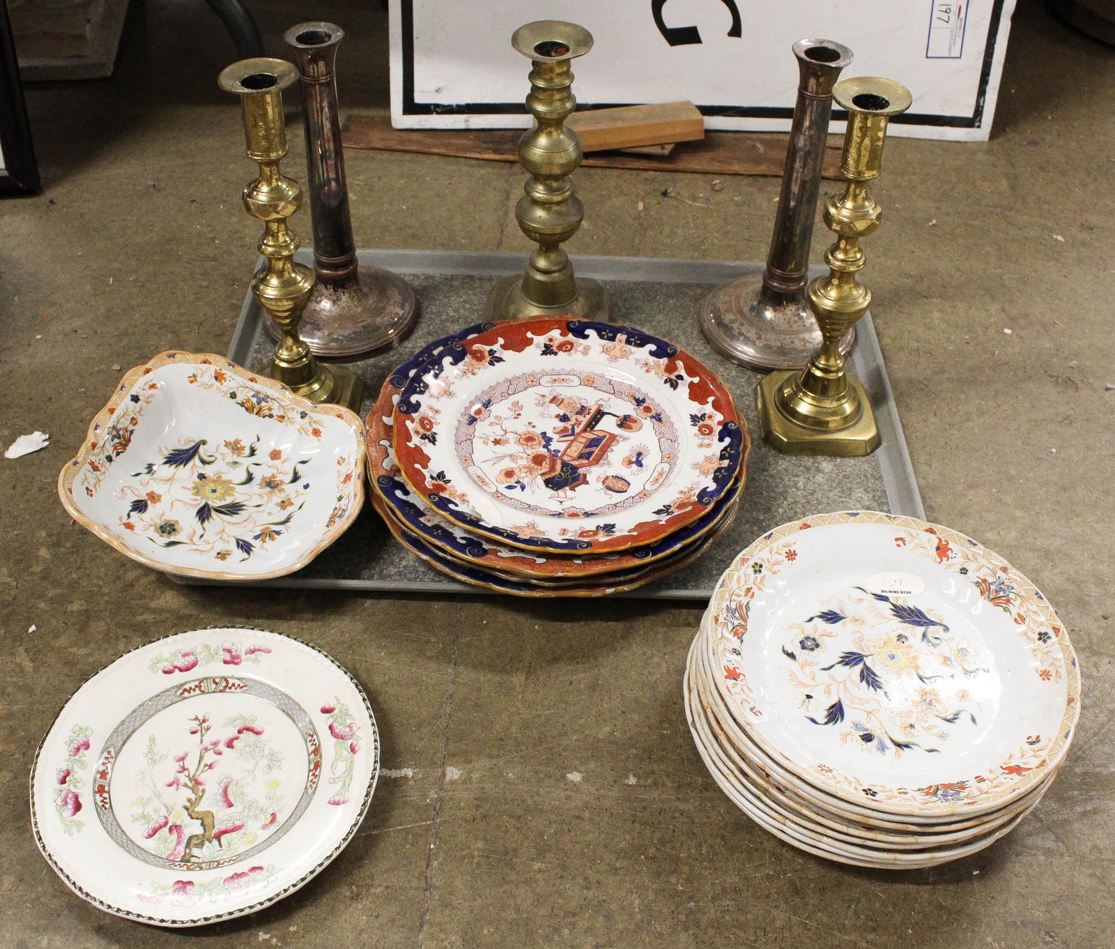 Imari Porcelain, Sheffield and Brass Candlesticks: 14 pcs of 19th c. Imari decorated porcelain dinnerware, acompanied by a pair of Sheffield silver candlesticks, pair of brass beehive push up candlesticks, single brass candlestick