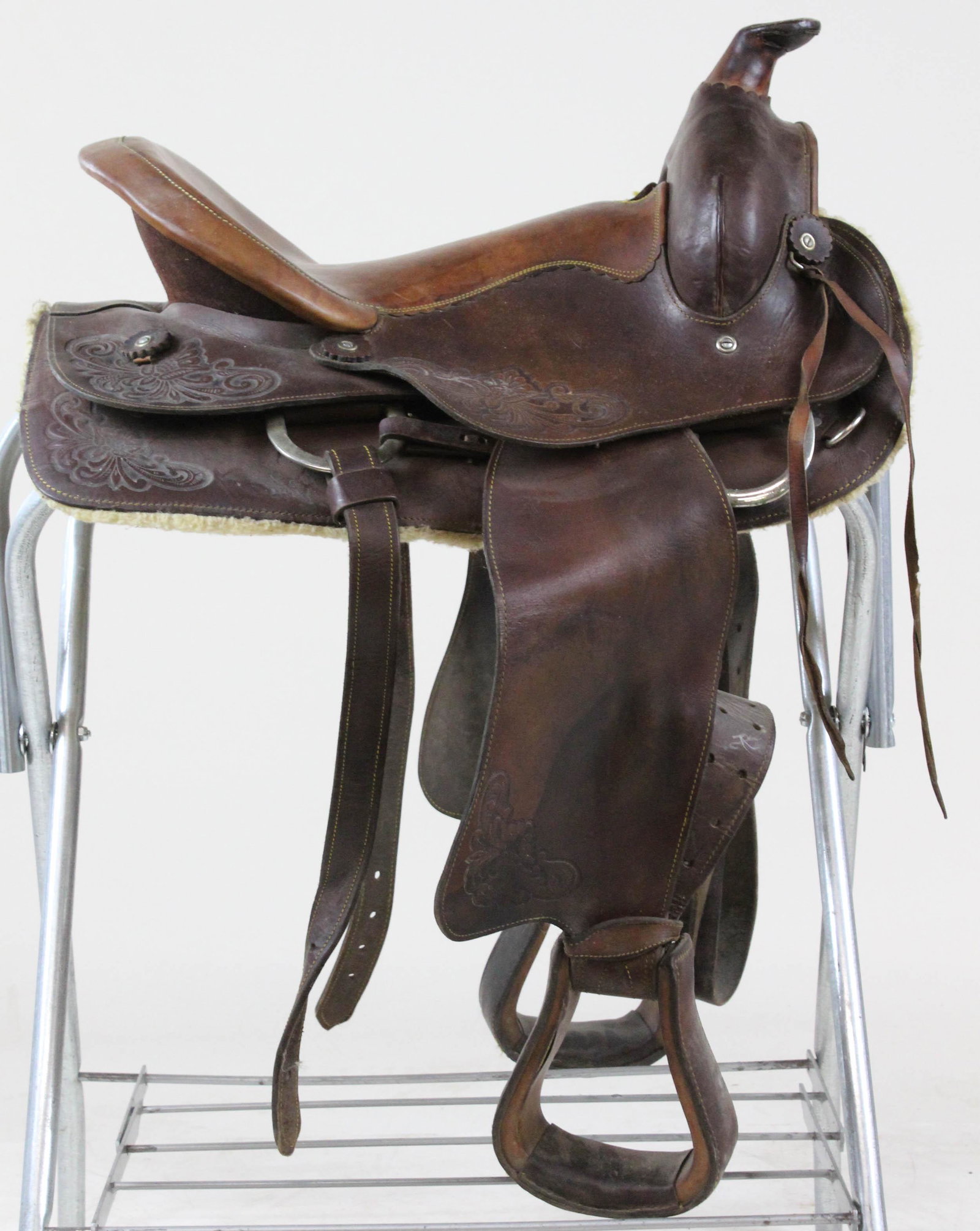 Early to Mid 20th C Western Saddle: Early to Mid 20th c Western Saddle with tooled leather decoration 25" long