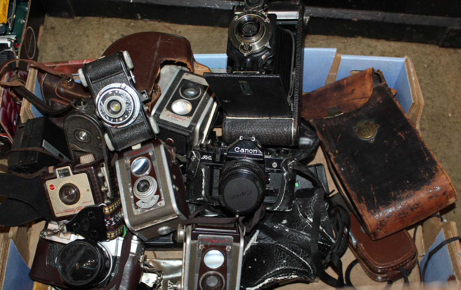 Lot of Cameras: Lot of Cameras including Keystone movie camera, Kodak Duraflex reflex cameras, Ricoh Singlex, Canon AE1, Kodak Autograph, Brownie Holiday Flask Camera