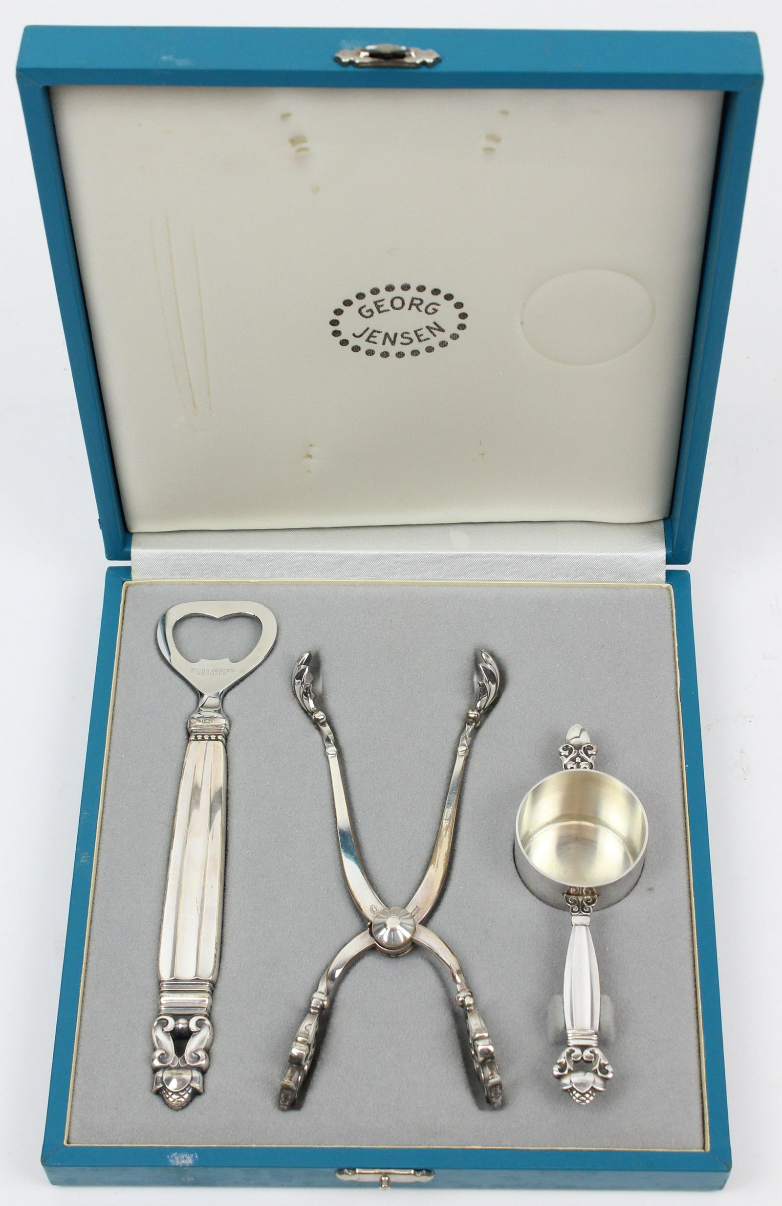 Georg Jensen 3 pc. Sterling Bar Utensil Set: 3 pc. Georg Jensen "Acorn" pattern Danish mid century sterling silver bar utensil mixing set consisting of bottle opener, jigger, and ice tongs (3.4 troy oz. weighable) in fitted presentation case