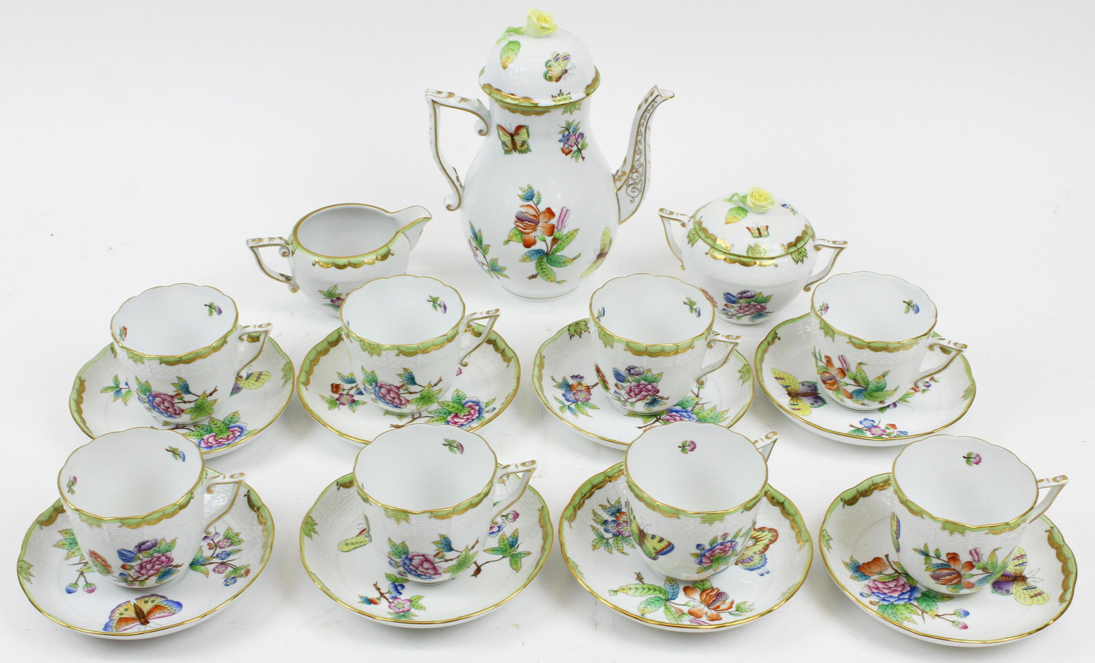 Herend Queen Victoria Porcelain Tea Set: Herend "Queen Victoria" pattern Hungarian porcelain tea set having vibrant colorful Orientalist floral and butterfly decoration with gilt scalloped green rims, consisting of teapot, covered sugar bowl