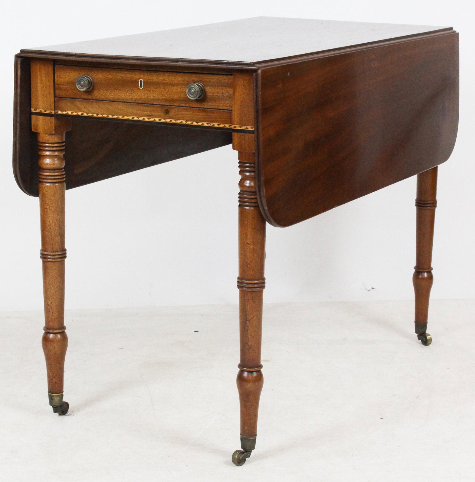 19th c English Regency Pembroke table: 19th c English Regency/Sheraton Pembroke table with banded inlay, fine dovetails and turned legs, 35 x 28 x 19" with 11" drop leaves. To be sold to benefit the Brattleboro Museum and Art Center.