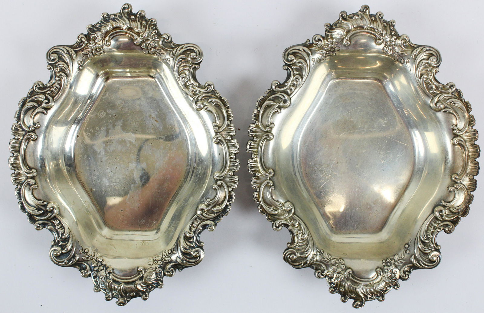 Pair of Reed and Barton Rococo Sterling Dishes: Pair of Reed and Barton Sterling Silver serving dishes with repousse rococo style shell and scroll edges 1.5" x 7.5" x 6" 9 troy oz.