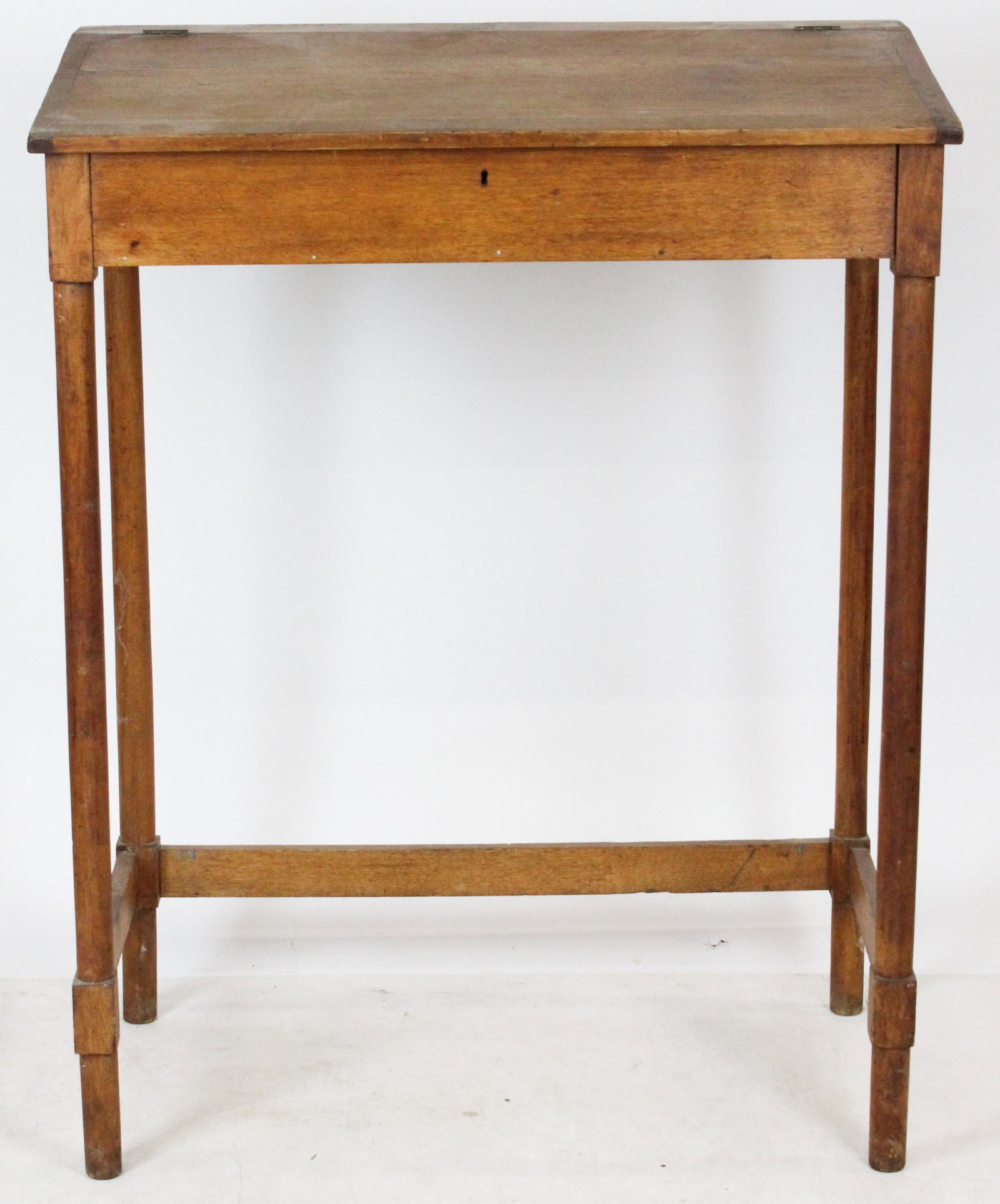 19th c Butternut School Master desk: Fine early 19th c station master's or school master's desk. Butternut, slant top, breadboard ends, pencil legs, 3 side stretcher. 48" h , 36" w, 20" deep.
