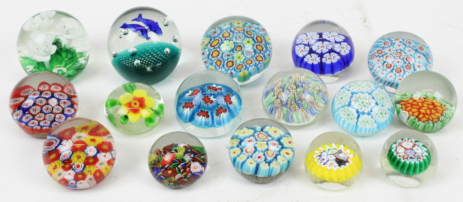 Collection of 16 Murano Art Glass Paperweights: Collection of 16 Murano Art Glass Paperweights including Goebel butterfly, dolphins, floral, millifiori, seed bubble, etc. dia. 1.5"-2.5"