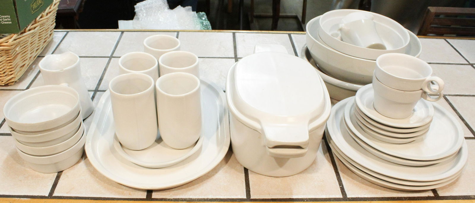 30 pcs. Bennington Pottery White Dinnerware: Collection of 30 pcs. Bennington Pottery white glazed dinnerware and bakeware including covered casserole, platters, pans, serving dishes, plates, cups (some David Gil/Yusuke Aida designs), etc. -some