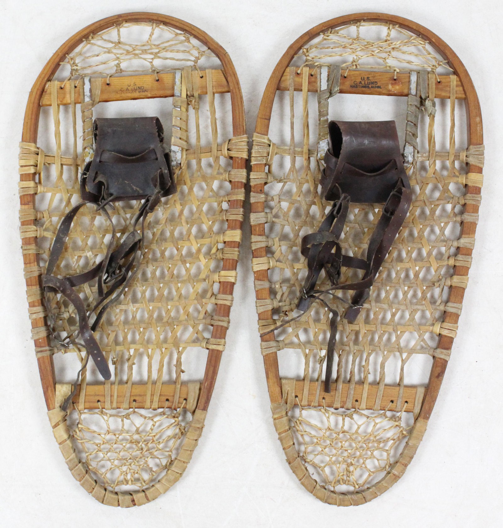 US Lund Bear Paw Snowshoes: US Lund bear paw snowshoes, pyrographic branded, length 27 1/2", crack on one bow