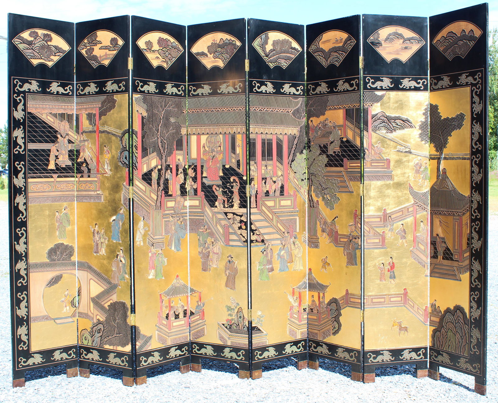 Chinese Eight Panel Coromandel Screen: Chinese eight panel painted gilt and Coromandel lacquer folding screen decorated with Court Scenes, each panel ht 8" x 18", maximum extended flat to 12'