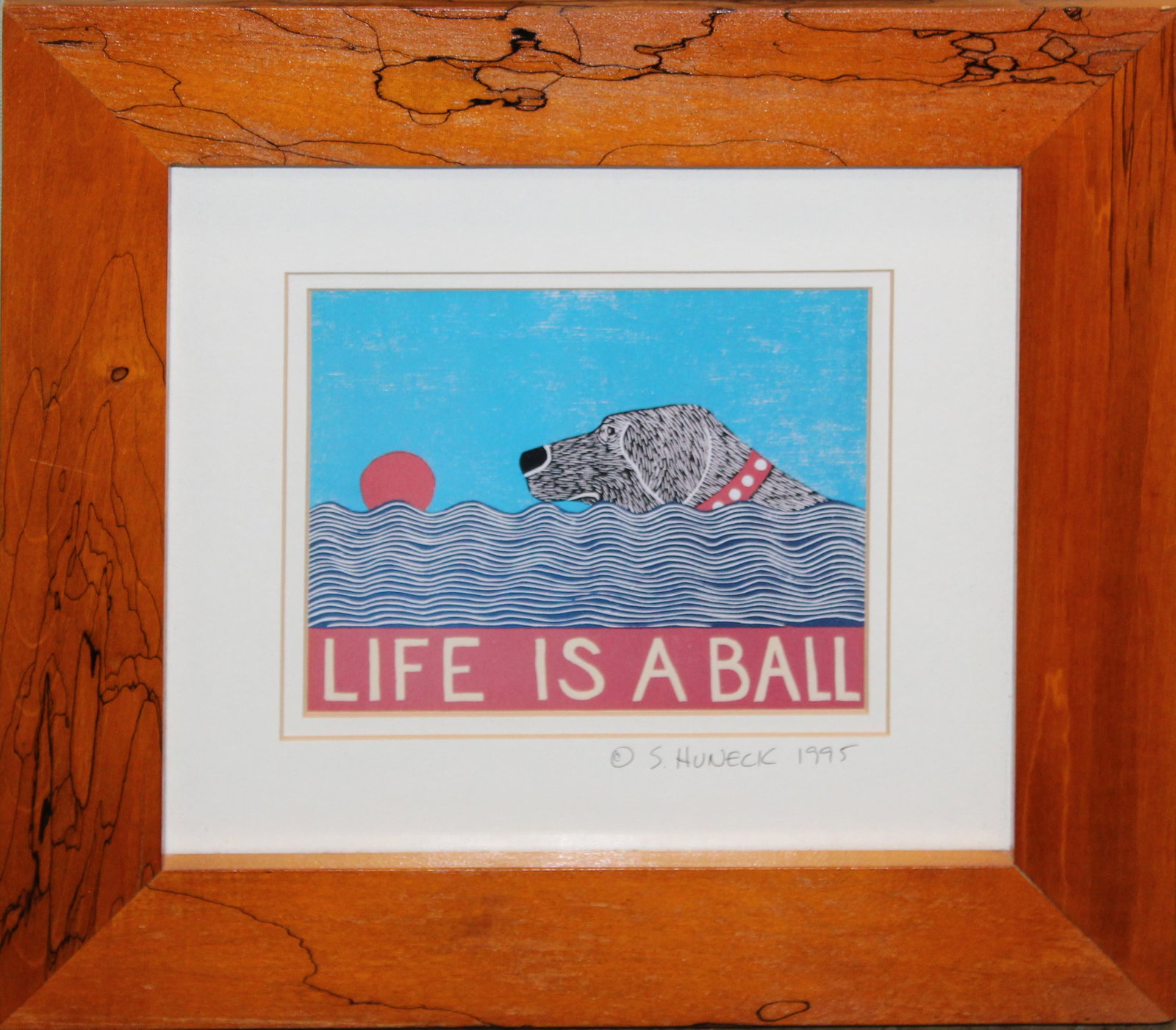 Stephen Huneck (VT 1948-2010) Life Is A Ball: Stephen Huneck (Vermont 1948-2010) Life is a Ball lithograph on paper signed and dated 1995 on mat in spalted maple frame 6 x 7"