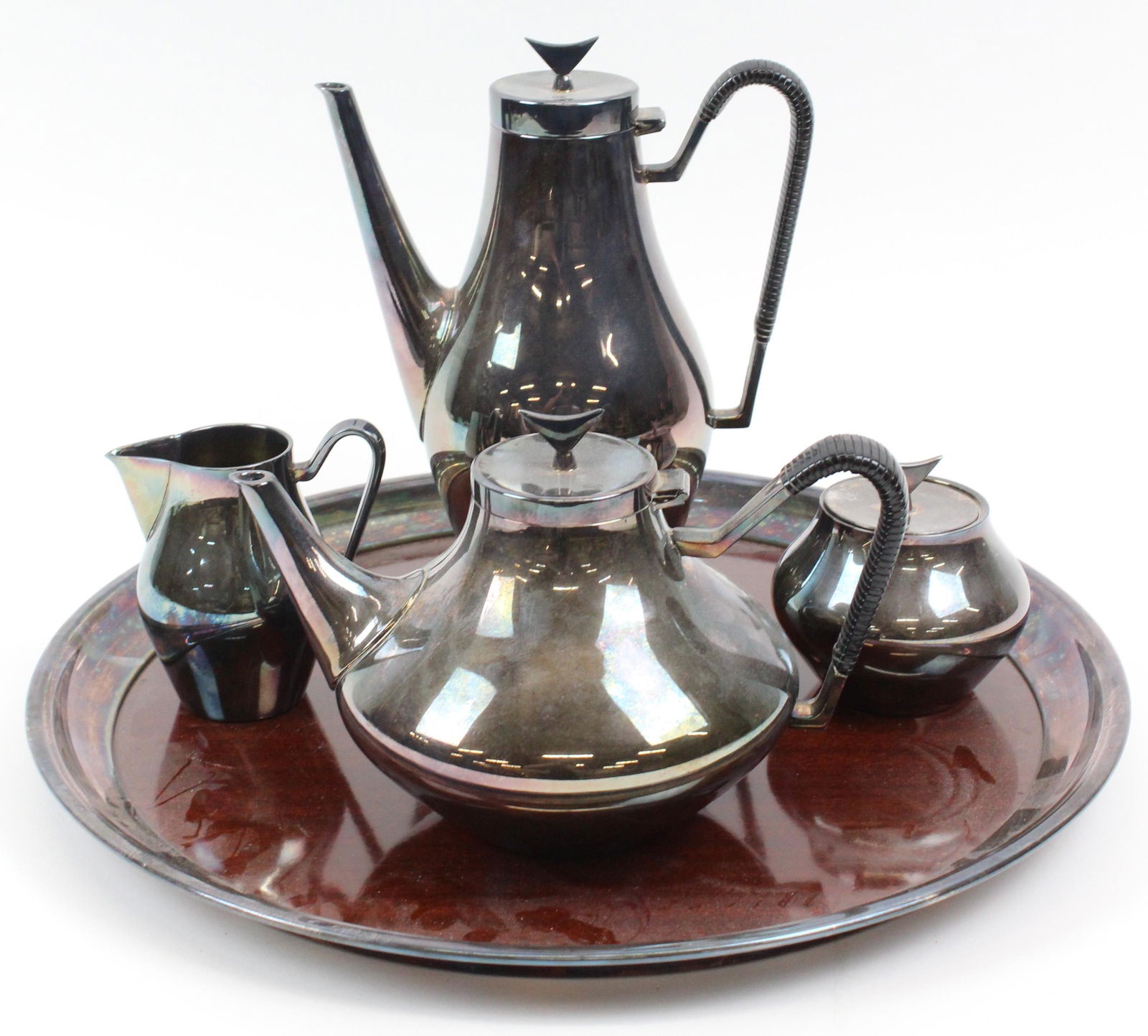 John Prip for Reed and Barton Denmark Tea Set: 1960's John Prip for Reed and Barton "Denmark" pattern Danish modern inspired silver plated tea set including teapot, coffee pot, covered sugar bowl and creamer, banded Formica tray ht. 4.5"-10"