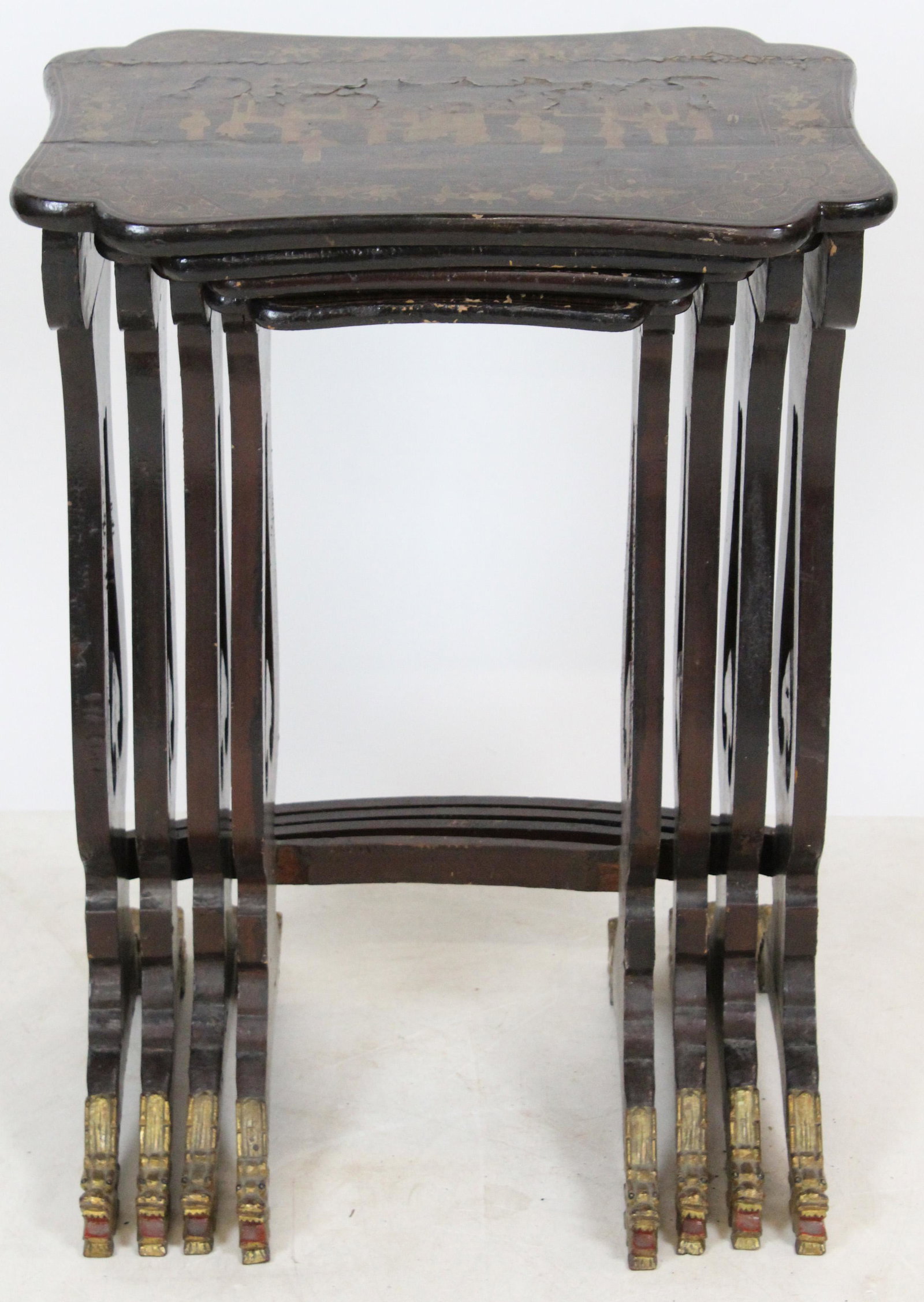 Nest of 4 Chinese Lacquered Tray Tables: Set of 4 Chinese lacquered nesting tables, carved gilt dragon head feet, Court scenes, some flaking, losses, ht to 27 1/2", width to 19 1/2"