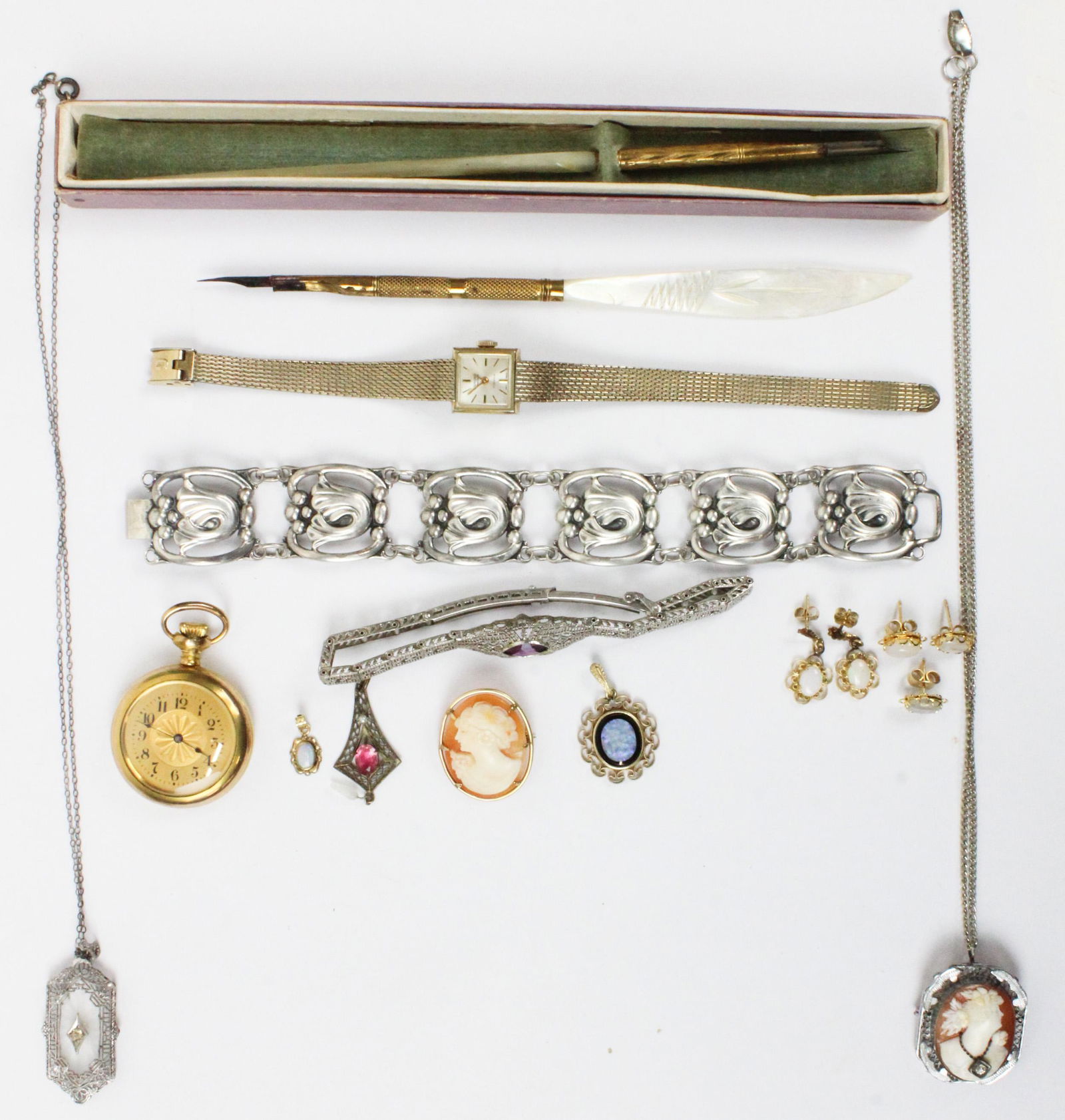 A Group of Vintage Jewelry: A group of Vintage Jewelry including mop pens, Sterling Canecraft bracelet, 2 Victorian cameos, an opal pendant & earring set, a open face gold pocket watch, a Gruen ladies watch, and other vintage pi
