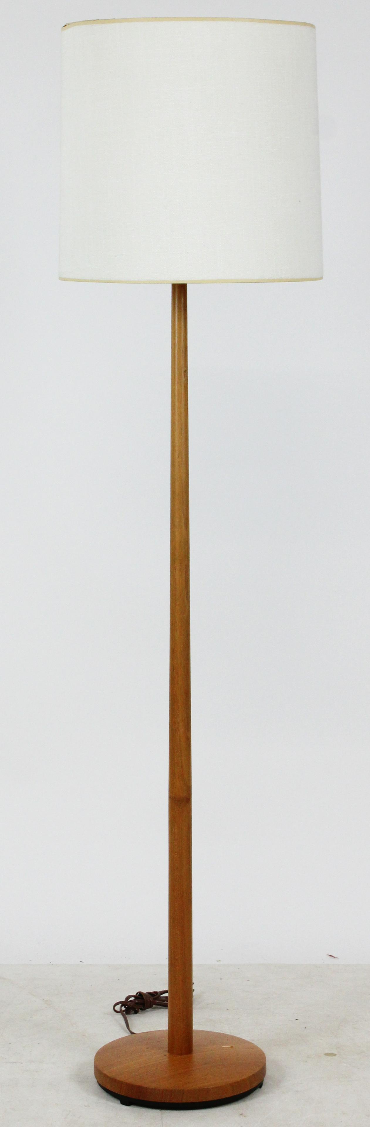 Attr. George Kovacs Swedish Teak Floor Lamp: Mid-20th c. attributed to George Kovacs modern minimalist design teak floor lamp having cylindrical linen covered shade, marked with metal tag underneath "Made in Sweden"