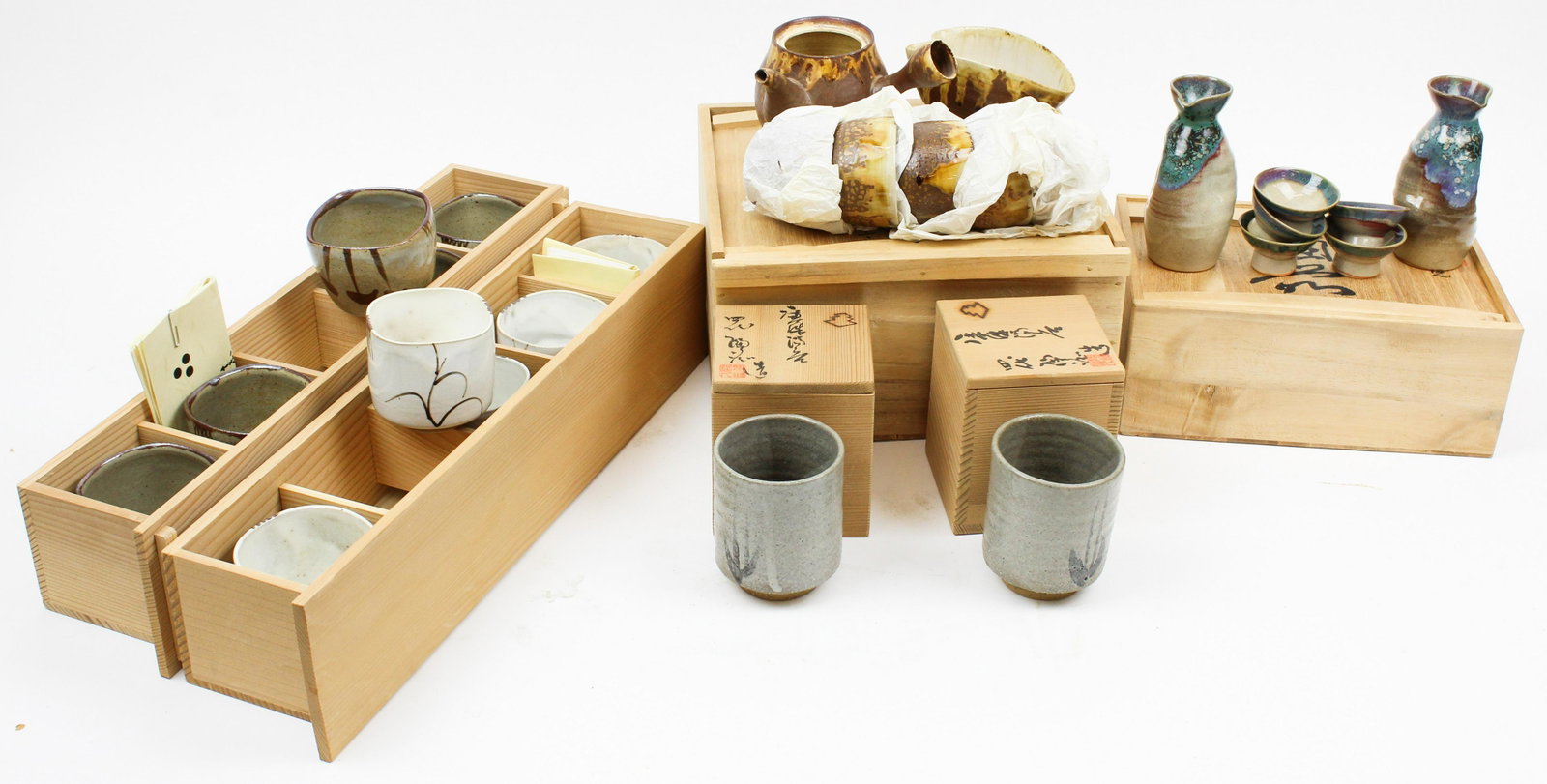 Lot of Japanese 1960's Pottery Tableware: Lot of Japanese 1960's pottery tableware gift sets in original fitted wood presentation boxes, including sake set, tea set, handless cups