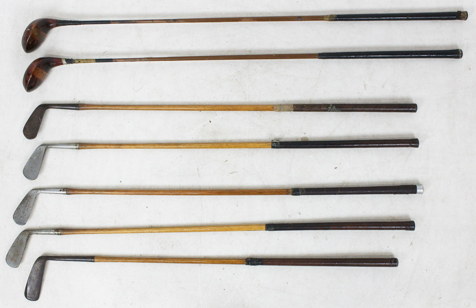 Early Golf Clubs incl Wooden Shafted: Wood shafted golf clubs, including three Crawford McGregor & Canby Co. clubs- Go-Sum mashie, number 4 mashie-iron, no 2 mid-iron, Spaulding Harr Bowler putter, sold with two early metal shafted Hiller