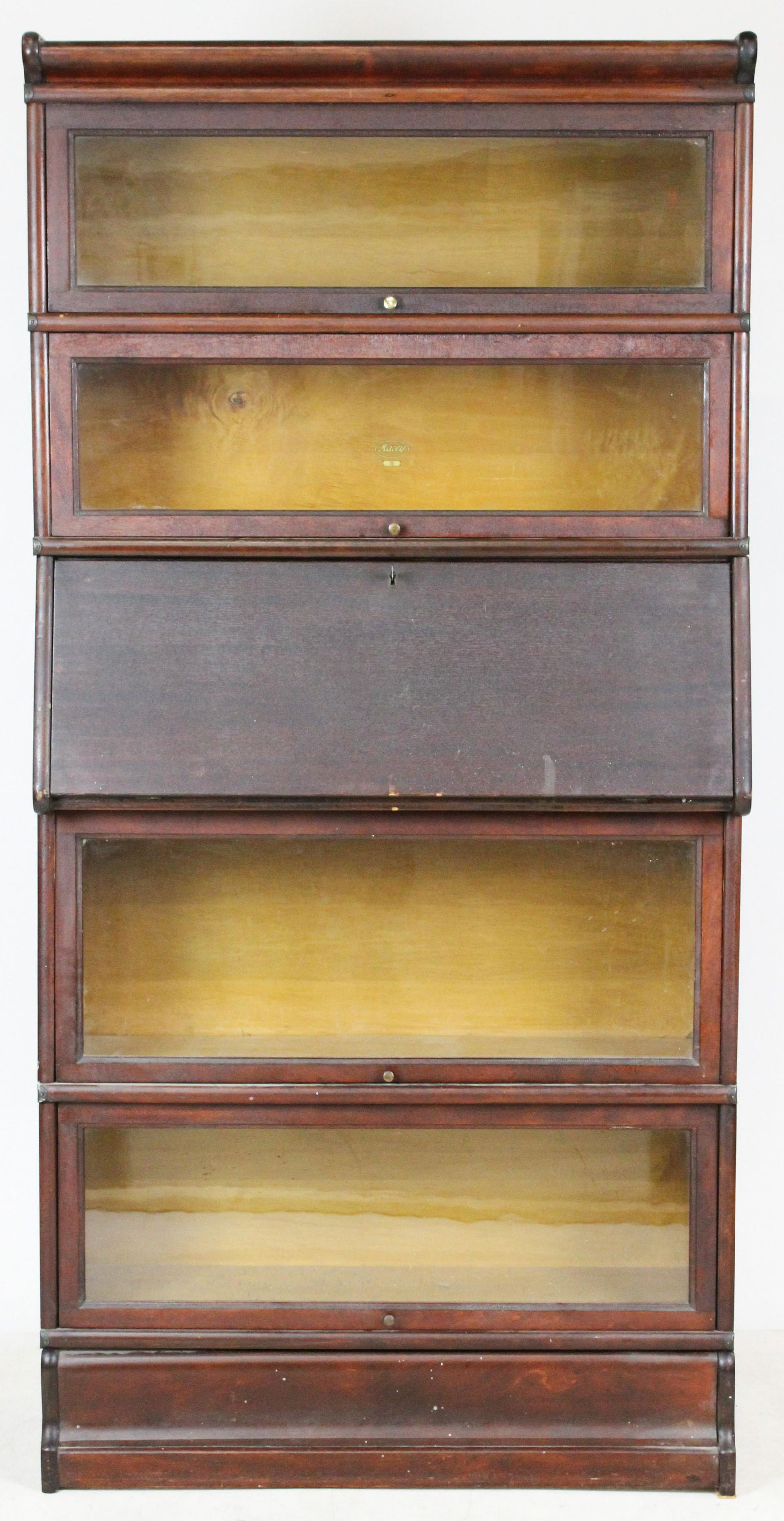 Macy Barrister's Stacking Bookcase: Macy mahogany 5 section stacking Barrister's bookcase, 4 bookcase sections in good condition, desk section veneer damaged, overall ht 70", width 34"