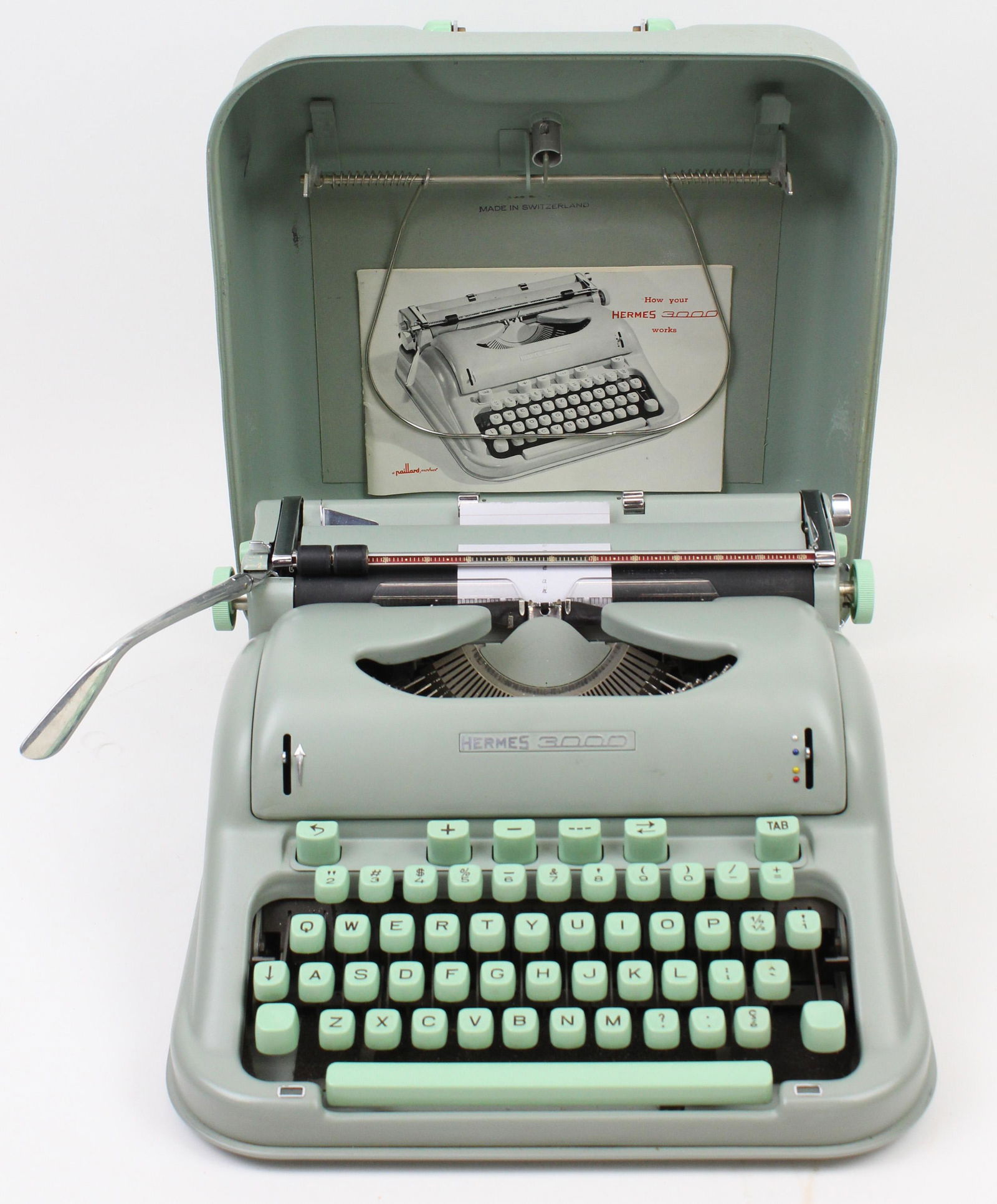Paillard Hermes 3000 Manual Typewriter: Paillard "Hermes 3000" Swiss manual portable typewriter, seafoam green, with case and instructions, 13" x 13"