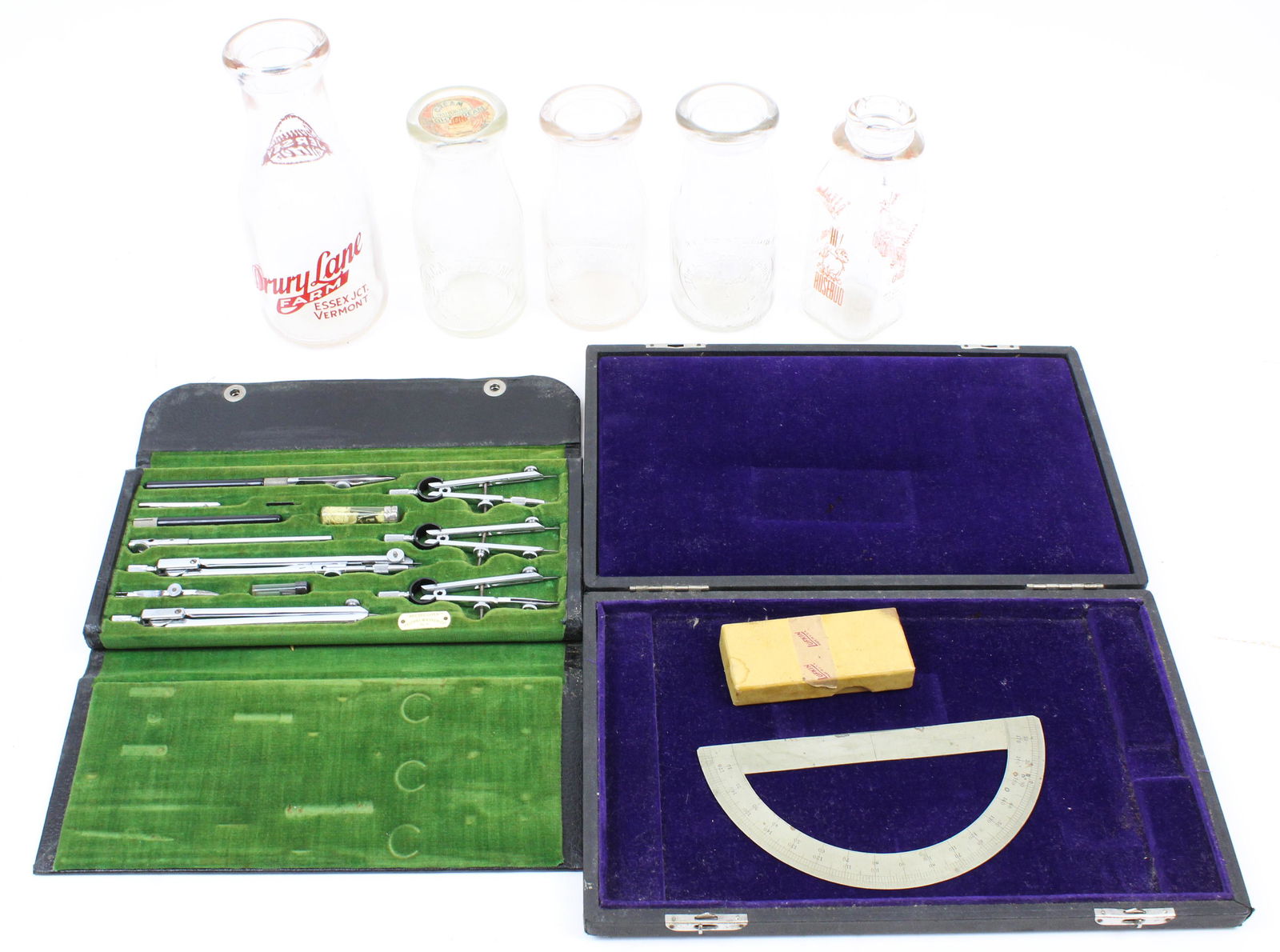 Group of Vermont Milk Bottles, Drafting Set: Group of 5 milk bottles including scarce Drury Lane Farms Essex Junction, VT pyro glazed bottle, 2 Ethan Allen Essex Jct., VT embossed slug plate half pint bottles, BCMP Burlington embossed slug plate