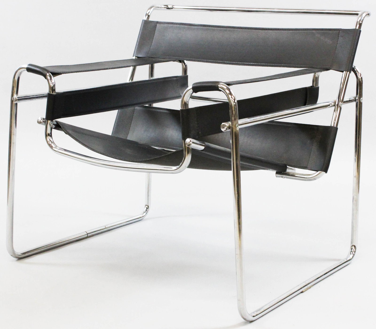 Wassily Type Chrome Chair After Marcel Breuer: Late 20th c. Wassily type modern tubular chrome and black leather sling armchair after Marcel Breuer