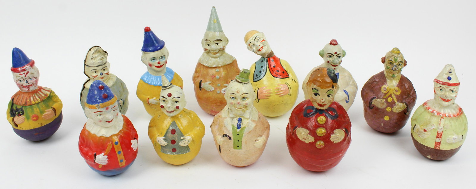 Early 20th c Roly Poly Clown Toys: Early 20th c Roly poly clown toys (12 pcs), some damaged, hts 6" to 8"