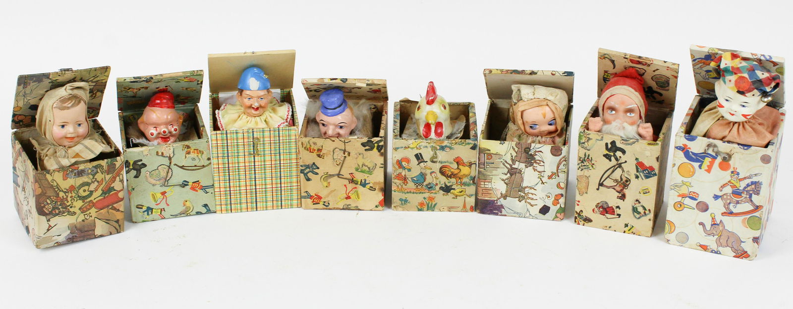 Eight Early 20th c Jack In The Boxes: Eight early 20th c jack-in-the-boxes, some damaged, sizes 3 1/2" x 3 1/2' to 3 1/2" x 5"