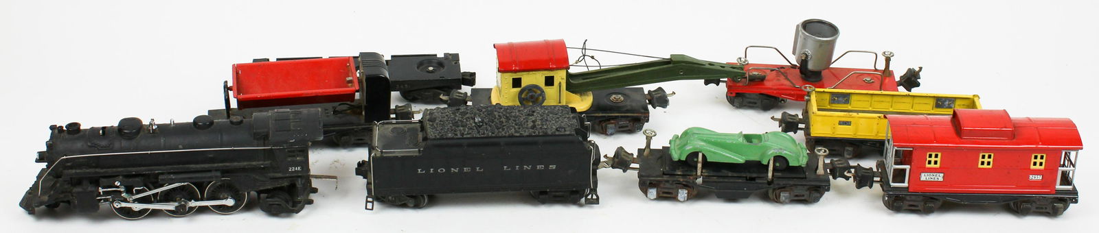 Lionel Pre-War Train Set: Lionel Pre-War 224E locomotive (wheel linkage damaged), 2224 tender, 2620 spotlight, 2657 caboose, 3652 side dump, flatbed, side dump