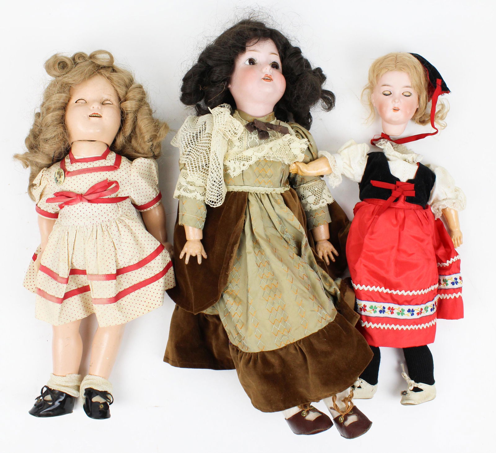 C M Bergman, Heinrich Handwerk, Ideal Dolls: 20" C M Bergman German bisque doll (head glues), 17" Heinrich Handwerk German bisque doll (head damaged), 18" ideal Shirley temple composition (repaired at back of socket)